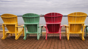 Image of different colored Adirondack chairs.