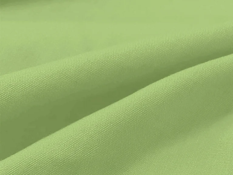 Close-up of green fabric with folds
