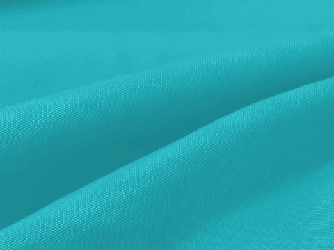 Close-up of turquoise fabric with folds