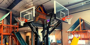 Wooden playsets, and basketball hoops built at River City Play Systems showroom.