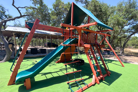 Colorful playground structure with slides and climbing areas on a sunny day.
