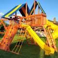 Colorful playground with slides and swings on a grassy area
