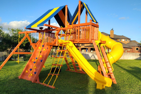 Colorful playground with slides and swings on a grassy area